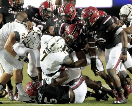 South Carolina's defense wraps up Vanderbilt's Ralph Webb during first-quarter action in Nashville, Tenn. on Thursday, Sept. 1, 2016. (Travis Bell/SIDELINE CAROLINA)