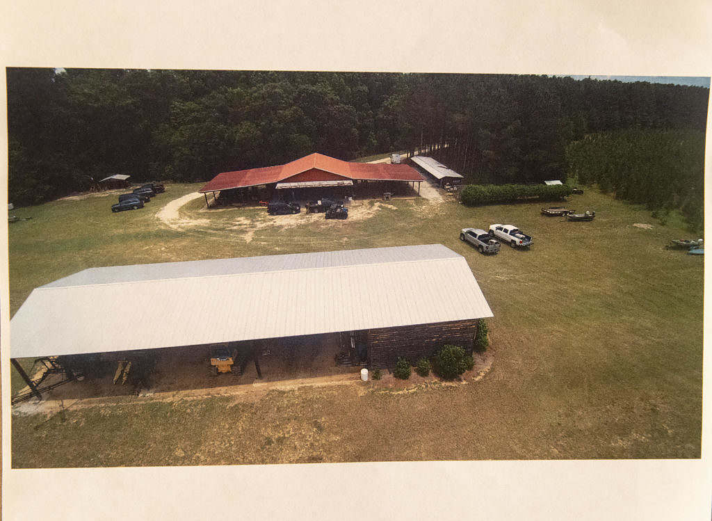 MurdaughTrialImage_evidence-240_52666162528_zoomed out shot of dog kennel_covered shed w_ construction equipement